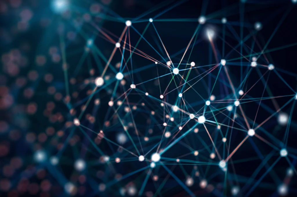 Visualizzazione astratta e fotorealistica di una rete complessa tridimensionale, simboleggiante le interconnessioni nella comunicazione scientifica e l'eredità intellettuale di Loet Leydesdorff. Nodi luminosi collegati da linee energetiche fluttuanti in uno spazio scuro. Obiettivo grandangolare, 15mm, messa a fuoco nitida, sensazione di profondità e complessità.