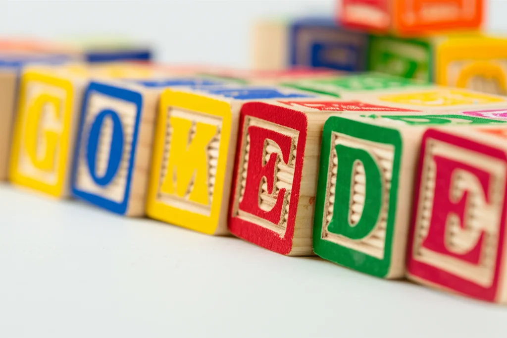 Fotografia macro di blocchi colorati in legno con lettere incise, usati nella logopedia infantile. Obiettivo macro 100mm, alta definizione, illuminazione controllata da studio, focus preciso sulle venature del legno e sui colori vivaci.