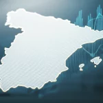 Primo piano di una mappa della Spagna con diverse aree evidenziate a simboleggiare i mercati del lavoro locali, sovrapposta a grafici stilizzati che indicano crescita economica e aliquote fiscali. Utilizzare un obiettivo da 24-35mm, con un effetto duotone blu e grigio per un look moderno e analitico, profondità di campo per mettere a fuoco la mappa mantenendo i grafici leggermente sfocati sullo sfondo.