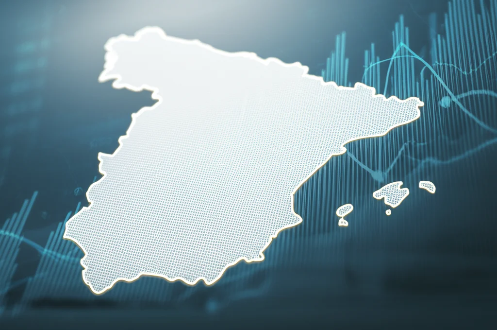 Primo piano di una mappa della Spagna con diverse aree evidenziate a simboleggiare i mercati del lavoro locali, sovrapposta a grafici stilizzati che indicano crescita economica e aliquote fiscali. Utilizzare un obiettivo da 24-35mm, con un effetto duotone blu e grigio per un look moderno e analitico, profondità di campo per mettere a fuoco la mappa mantenendo i grafici leggermente sfocati sullo sfondo.