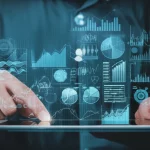 A person's hands hovering over a tablet displaying complex stock charts and abstract data visualizations, 35mm portrait, depth of field.