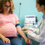 Photorealistic image of a pregnant woman having a blood sample taken by a nurse, 35mm portrait, depth of field, controlled lighting, medical setting