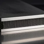 A detailed macro shot of a multiport mini-channel tube used for refrigerant flow boiling experiments, 60mm macro lens, high detail, precise focusing, with subtle reflections indicating metallic surface, controlled lighting.