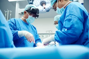 A photorealistic depiction of a pediatric cardiac surgery team, including surgeons and anesthesiologists, mid-procedure in a brightly lit, advanced operating room. Prime lens, 24mm, capturing the focused intensity and teamwork, with a slight depth of field. The image should convey hope and precision.