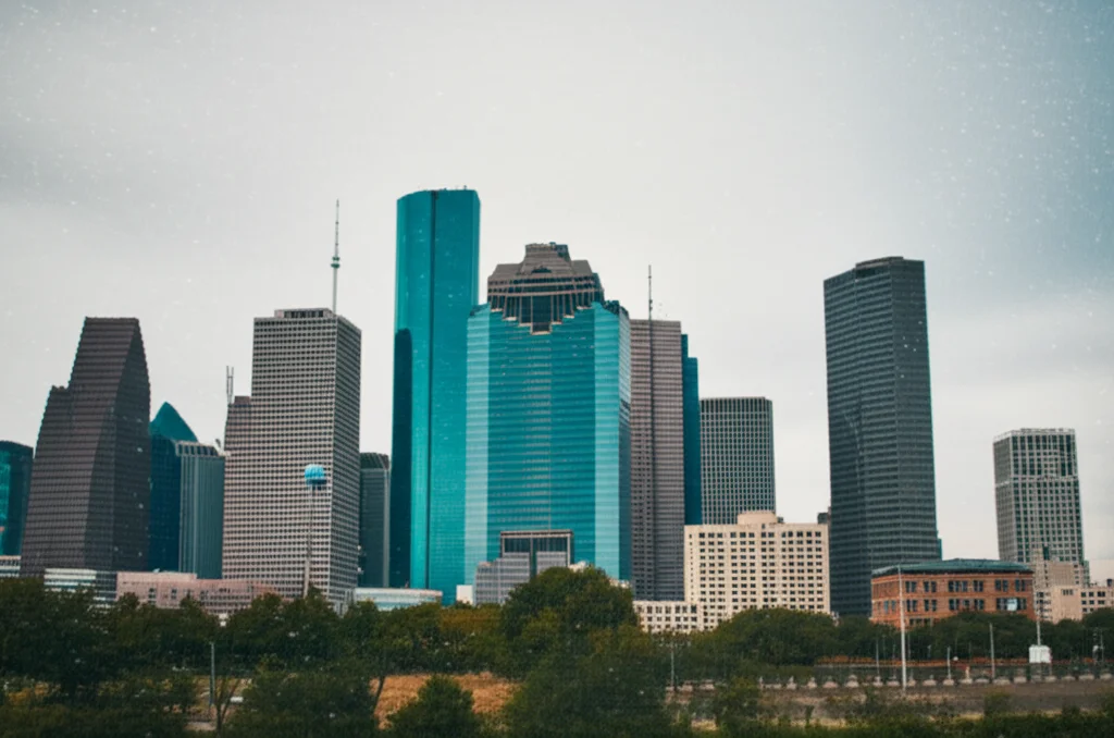 Urban Houston skyline with visible air particles, wide-angle lens, 24mm, sharp focus, showing the context of the study.