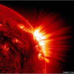 Astronomical wide angle 10mm photo of a powerful solar flare erupting, showing intense light and plasma, sharp focus, long exposure