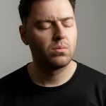 A person experiencing discomfort, 35mm portrait, depth of field.