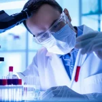 Scientific researcher examining blood samples under controlled lighting in a laboratory, macro lens, 60mm, high detail.