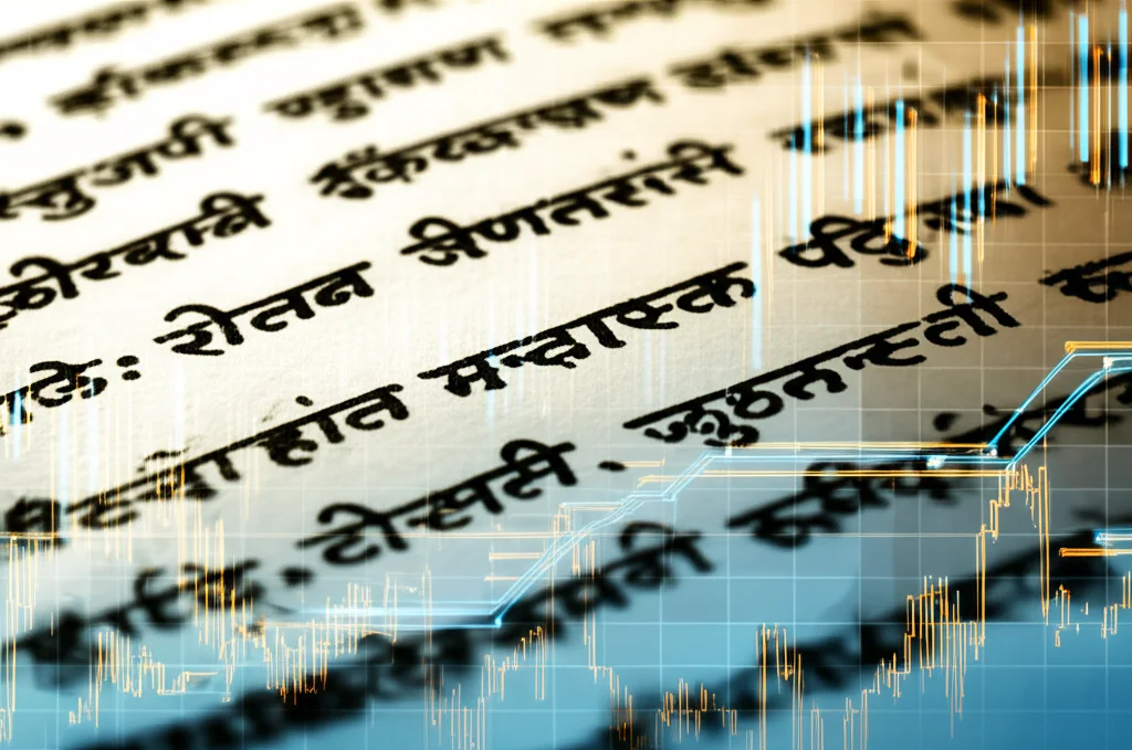 Un'immagine concettuale che mostra antichi manoscritti Hindi con caratteri Devanagari finemente dettagliati, sovrapposti a grafici di dati digitali luminosi e astratti di colore blu e arancione, simboleggiando l'incontro tra tradizione linguistica e analisi moderna. Lente prime da 50mm, illuminazione drammatica con forte contrasto tra la calda luce sui manoscritti e la fredda luce dei dati digitali, duotone seppia e blu ciano per un effetto suggestivo, alta definizione, profondità di campo per mantenere a fuoco sia i dettagli del manoscritto che la chiarezza dei grafici.