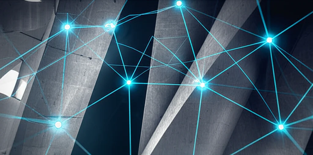 Visualizzazione astratta di una rete neurale complessa con nodi luminosi blu e connessioni brillanti su sfondo scuro, sovrapposta a un'immagine di una moderna struttura architettonica in calcestruzzo, colori duotone blu e grigio grafite, effetto profondità di campo per evidenziare la rete.