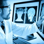 Scientist working with DNA data and medical scans on a computer screen, 35mm portrait, depth of field, blue and grey duotones.