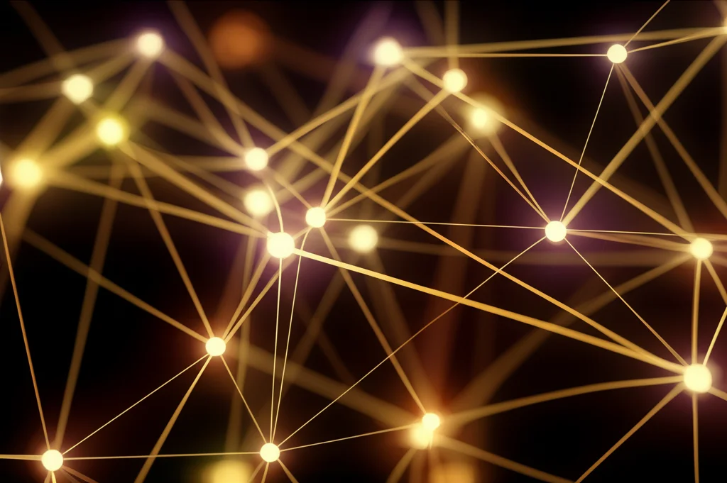 Fotografia macro di una complessa rete neurale astratta e luminosa, con nodi brillanti e connessioni filamentose, obiettivo macro 90mm, alta definizione, illuminazione controllata e drammatica che crea forti contrasti, focus preciso su alcuni nodi centrali interconnessi, sfondo scuro e sfocato.