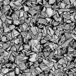Macro lens shot, 105mm, high detail, precise focusing, controlled lighting, showing the intricate microstructure of a metal alloy after cryogenic treatment, highlighting fine grains and complex internal structures.
