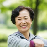 35mm portrait of a vibrant, smiling older Chinese woman exercising outdoors, depth of field