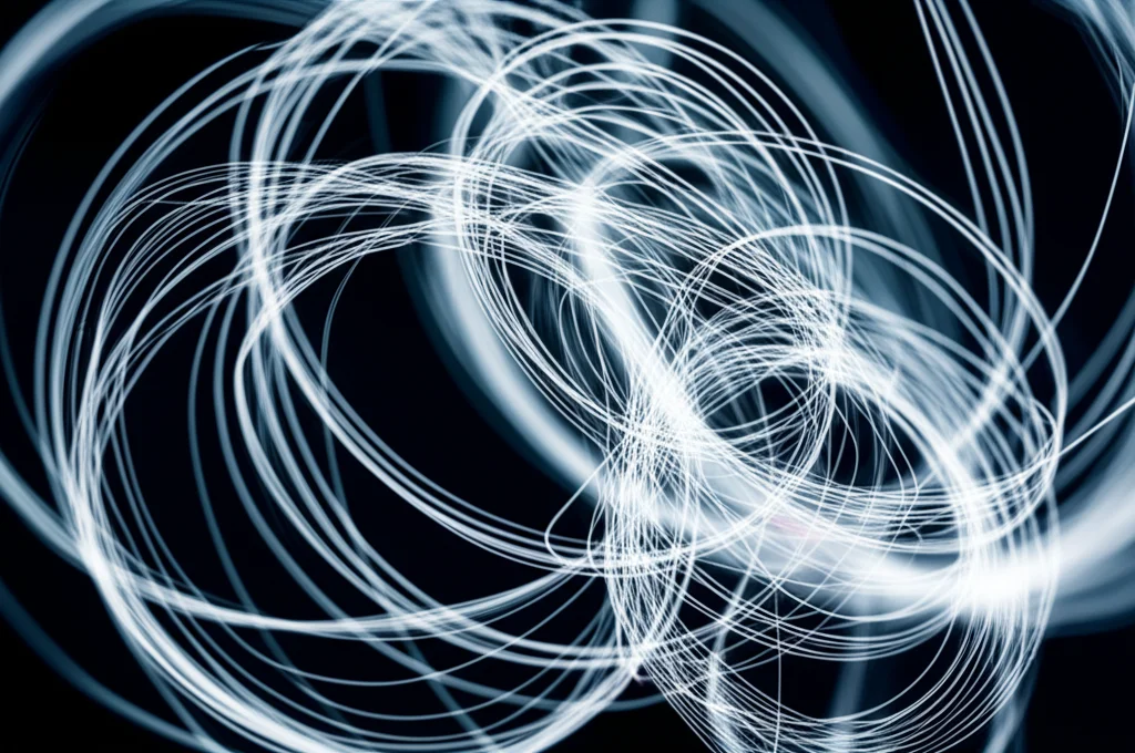 An abstract representation of interconnected thoughts or memories, captured with a macro lens at 60mm, showing high detail and precise focusing under controlled lighting.