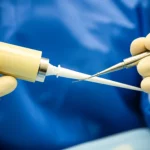 Close-up view of advanced bone cement material being prepared for surgery, macro lens, 60mm, high detail, controlled lighting