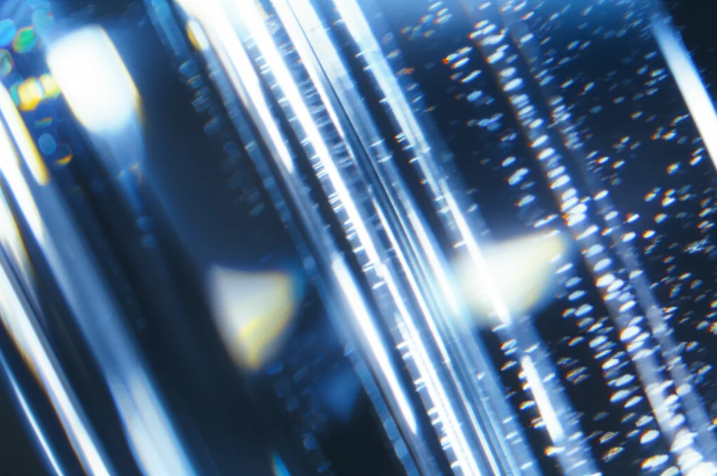 Photorealistic image showing a subtle light scattering effect within a transparent material, abstract, high detail, precise focusing, controlled lighting.