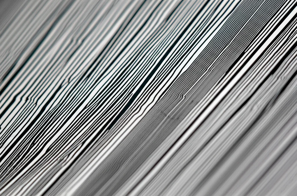Macro lens photo of a polished Ti-Al alloy sample showing intricate lamellar microstructure, high detail, controlled lighting, 60mm.